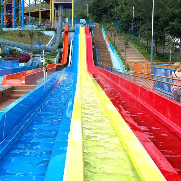 Quality Multi Lane Racing Water Slide For Aqua Water Park With Rainbow Colors for sale