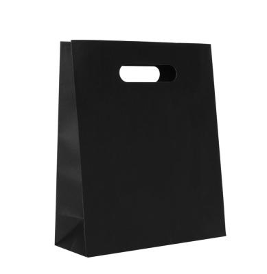 China Black Printing Kraft Paper Bag Flap Die Cut Handle Shopping Paper Bags for sale