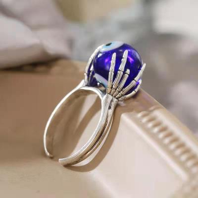 China CLASSIC Skeleton Open Blue Resin Props Open Halloween Ring Ghost Hand Ghost Evil Eye Ring 18K Copper Gold Plated Evil Eye Ring for sale
