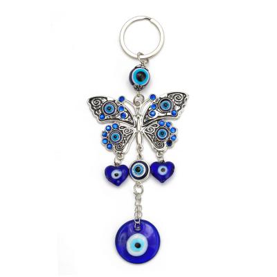 China Eco-Friendly The New Demon Tassel Keychain Fashion Key Chain Butterfly Evil Eyes Blue Eye Blue Eye for sale