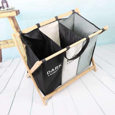 China Breathable Moistureproof 3 Bin Laundry Hamper Bamboo Frame Washable Lightweight for sale