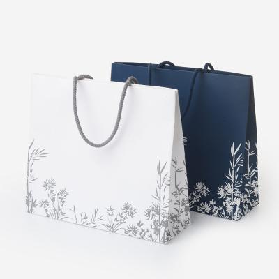 China Custom Matt Glossy Laminated White Art Paper Gift Bag With Handles For Shopping for sale