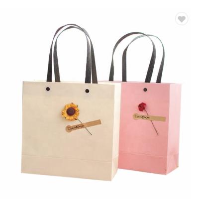 China Fashionable Reusable Embossed Art Boutique Paper Bag For Gift Shop for sale