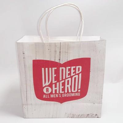China Custom Printed Paper Grocery Bags White Kraft Paper Kraft Gift Bags Foldable for sale