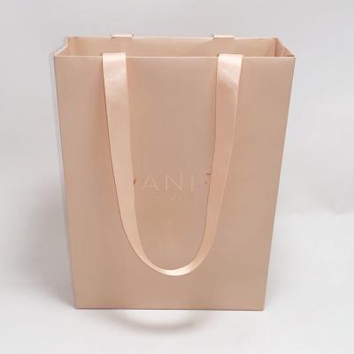 China Folding Jewelry Pouch Bags Custom Printed Kraft Paper Bags Full Color Printing for sale