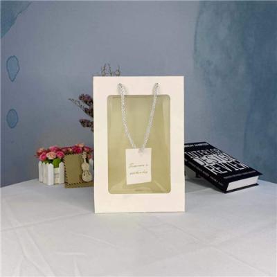 China Christmas Paper Gift Bags With Clear PVC Window for sale