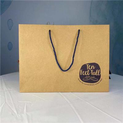 China Hot Stamping Logo Large Model Kraft Paper Gift Bags for sale