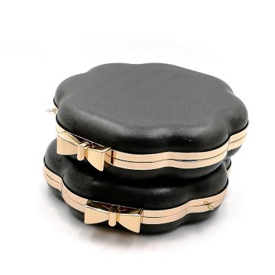 China Unique Bow Design Clasp Wavy Edge Round Shape Metal Box Clutch Frame for sale