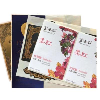 China Etiquetas de grabación en relieve de la hoja del sello del oro del pegamento de la comida del rollo del papel de imprenta de las etiquetas autoadhesivas del vino de la botella en venta