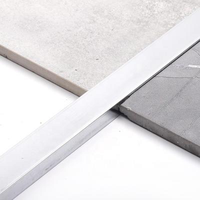 China tira de transición de acero inoxidable de aluminio de la pared de 6m m de la madera contrachapada de plata del piso en forma de 