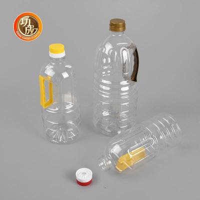 China Botella plástica de encargo del ANIMAL DOMÉSTICO del aceite de cocina de la botella de la salsa de soja de 1 litro con la manija en venta