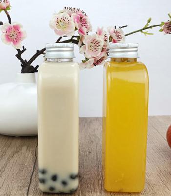 China Garrafas bebendo plásticas lisas de Juice Milk 400ml com tampão à venda