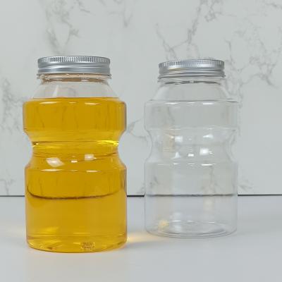 China 0.5L Food Grade PET Plastic Bottles Caps Ring Bucket Shape Juice Milk for sale