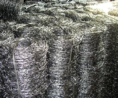 China Rustproof Double Wire Twist Braided 12 Gauge Barbed Wire Coil BWG12xBWG12 for sale