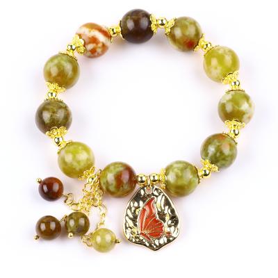 Chine Bracelet à perles en pierre précieuse faite à la main, pierre de sang de dragon jaune naturel, bracelet de charme réglable pour les fêtes. à vendre