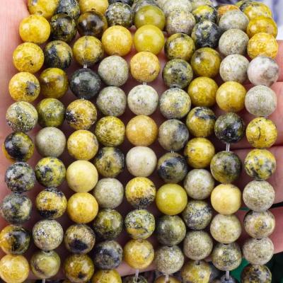 China Piedra preciosa pulida 6 mm 8 mm Perlas de Howlite amarillo para la fabricación de artesanías en venta