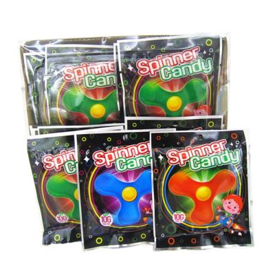 China Easter Halloween Sweets Colored Low Cal Lollipop With Finger Spinner Toy for sale