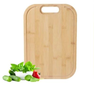China Custom Logo Bamboo Non Slip Cutting Board With Handle And Groove for sale