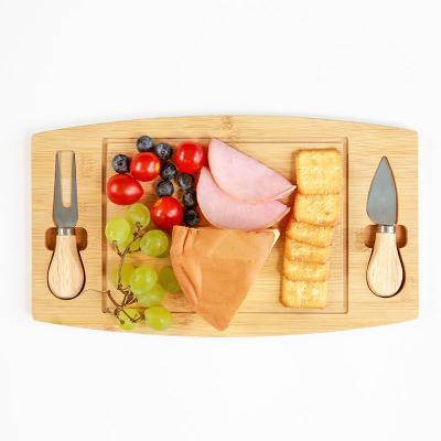 China Tabla de corte de madera bandeja de comida de bambú tabla de pizza para queso en venta