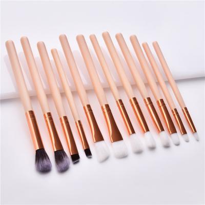 China Wood Handle Eye Shadow Makeup Brush Set 12pcs Black Rose Gold Pink for sale