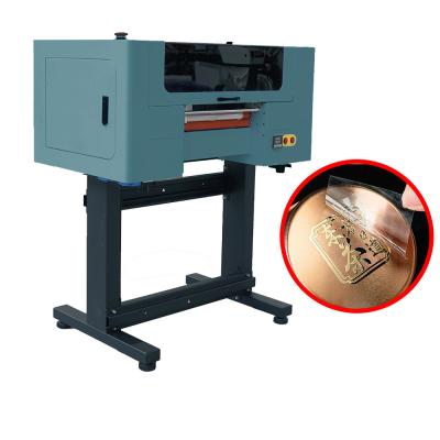 China Impresora de inyección de tinta multifunción DTf de rollo de película Impresora de inyección de tinta todo en uno en venta