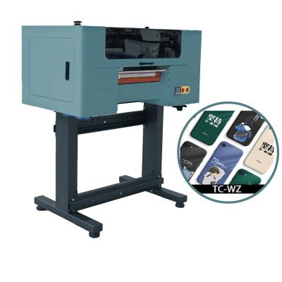 China Cmykw Varnish Plastic Digital Shirt Printing Machine T Shirt Inkjet Printer Machine for sale