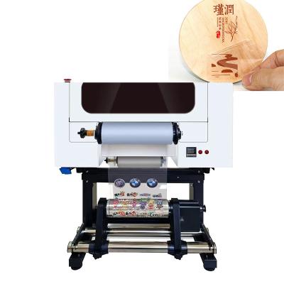 China Impresora Dtf de rollo UV de tamaño A3 para imprimir pegatinas Rollo para imprimir rollo en cualquier producto en venta