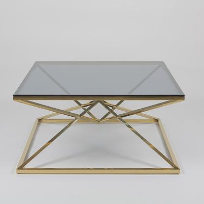 China Overlapping Triangles 0.5cbm Metal Frame Coffee Table With Clean Glass for sale
