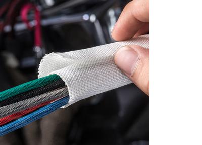 China Hot Knife Cutting Cable Protection Sleeve , Self Wrapping Braided Sleeving Custom for sale