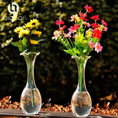 China Transparent long neck falbala glass flowers vase for sale