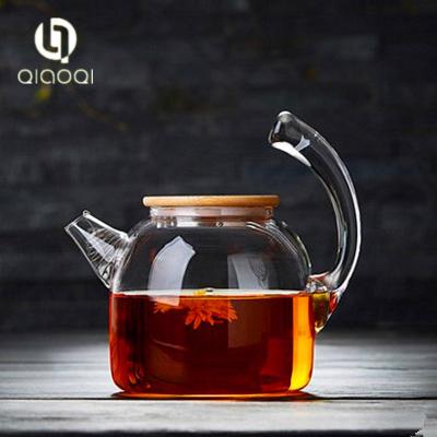 China high borosilicate glass teapot with handle and wooden lid for sale