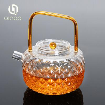 China 700ml hand made heat resistant tea pot with golden color handle for sale