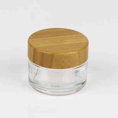 China tarros de cristal cosméticos transparentes de 40ml 75ml 180ml con la tapa de bambú en venta
