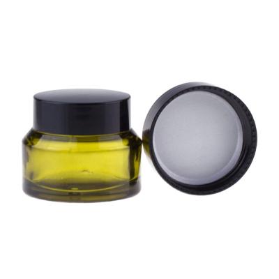 China IS09001 Glass Face Cream Jars Clear Olive Green Glass Cylinder Jars With Lids for sale