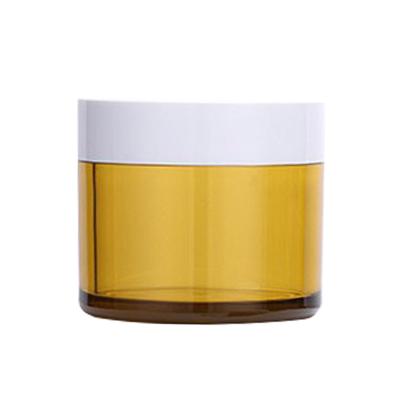 China SGS 120g 150g Cosmetic Yellow Glass Jar Round Glass Canister With Lid for sale