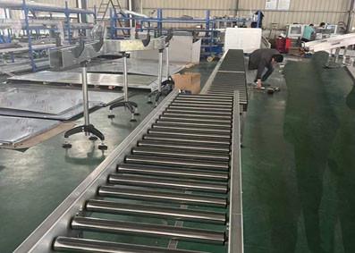 China Heavy Duty Roller Conveyor Packing Line Working Table Production Line Bed Table en venta