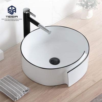 China Modern Bathroom  Ceramic Gold Black Wash Basin Countertop Sanitary Ware à venda