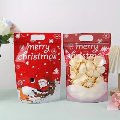 China Customized Printed Stand Up Pouch Zipper Christmas Gift Wrap Bags With Handle Hole for sale
