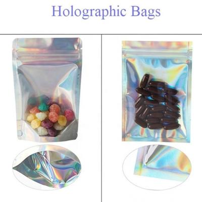 China 0.5OZ Holographic Stand Up Pouch Silver ziplockk Foil Bag Pouches With Tear Notch for sale