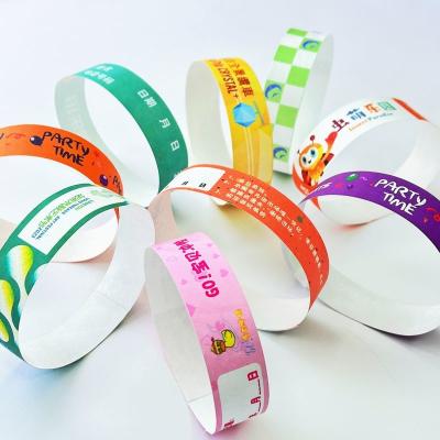 China Custom Printed Tyvek Paper Wristbands with Snap Closure Waterproof Sequential Numbering for sale