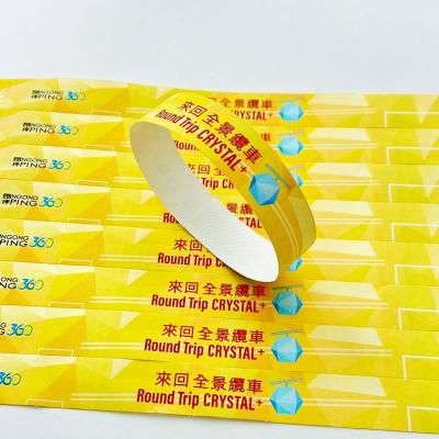China Custom Logo Waterproof Tyvek Wristbands Full Color Sequential Numbering Snap Closure en venta