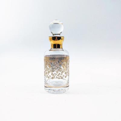 China Botella de perfume árabe de vidrio patrón floral botella de perfume redonda ligera en venta