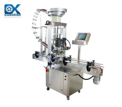 China Capping MachineS olid Work Rotary Process Principle Price Press Plastic Bottle With Cap Elevator en venta
