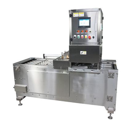 China Control PLC bandeja de vacío de acero inoxidable máquina de sellado de comidas listas para bocadillos contenedores de nueces en venta