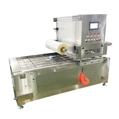 Chine Machine d'emballage de plateau à œufs machine d'emballage de plateau à nourriture automatique à vendre