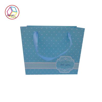 China Personalised Shopping Bags Blue Color Coated Paper Twisted Handle for sale
