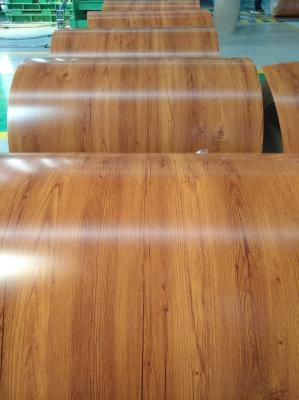 中国 AA3105 カラーコーティング アルミコイル 木色ポリエステルコーティング アルミコイル 飾り付けやドア材料のための作業 販売のため