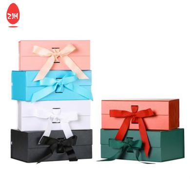 China FSC Ribbon Magnetic Closing Gift Box Ribbon Gold Foil Folded Packaging for sale