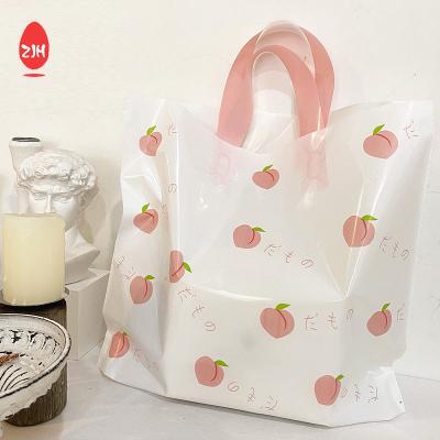 China La bolsa de asas plástica del modelo del melocotón de la tienda de ropa de los bolsos del embalaje del regalo del estilo del LDPE Ins en venta