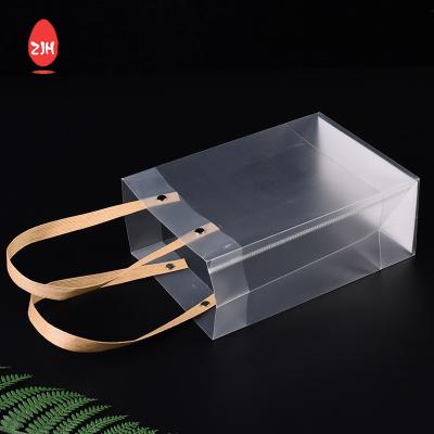 China Las bolsas de asas transparentes del regalo del vestido cosmético del bolso de compras plástico del LDPE en venta